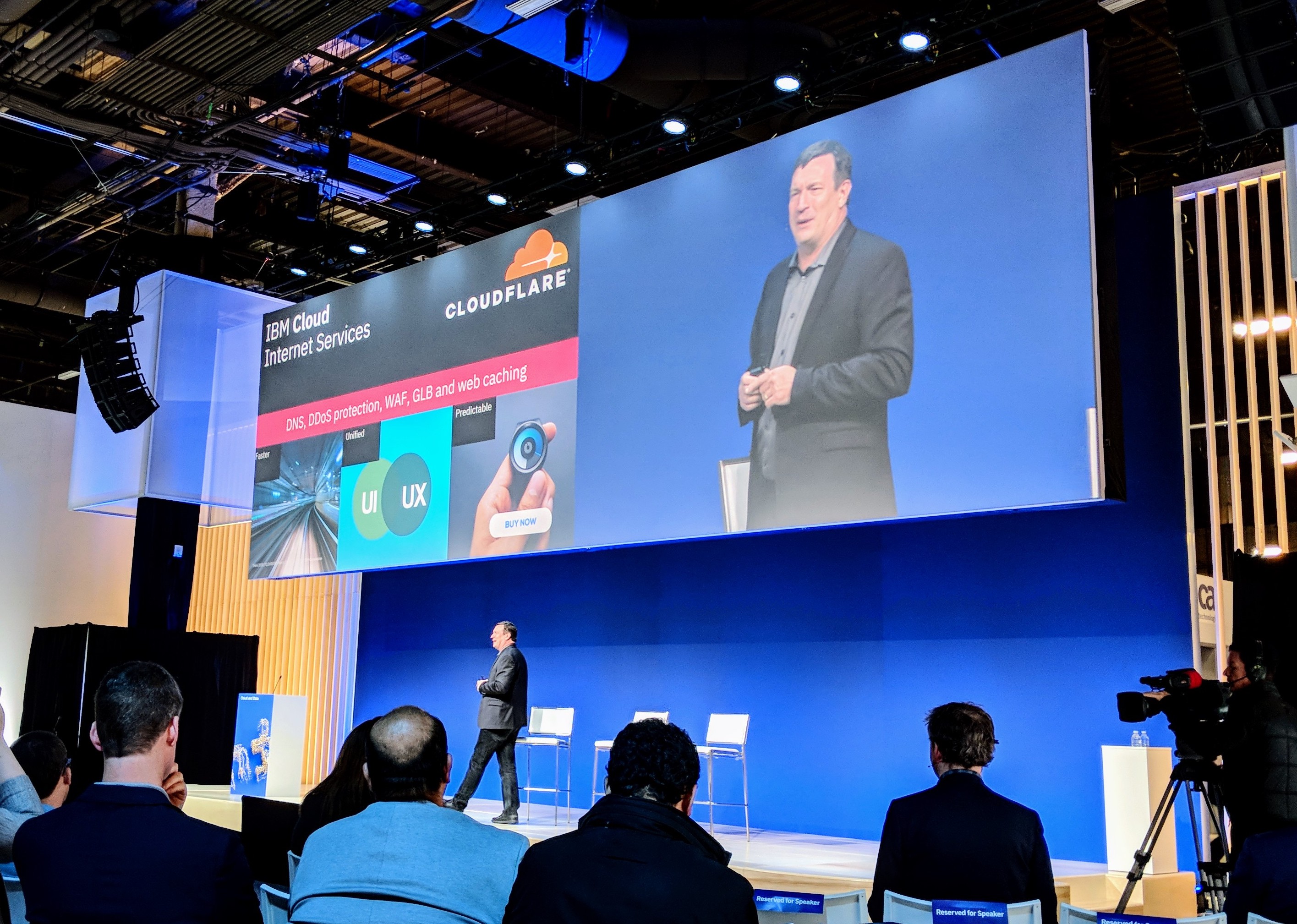 Image of John Considine (GM IBM Cloud) announcing release of CIS at Think 2018